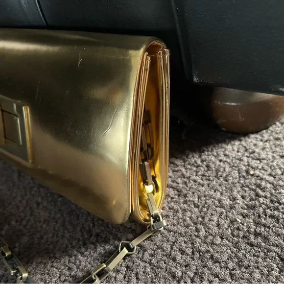NWT - Olga berg gold clutch bag. NWT. Comes with chain strap. Rectangular clasp. - Picture 6 of 15